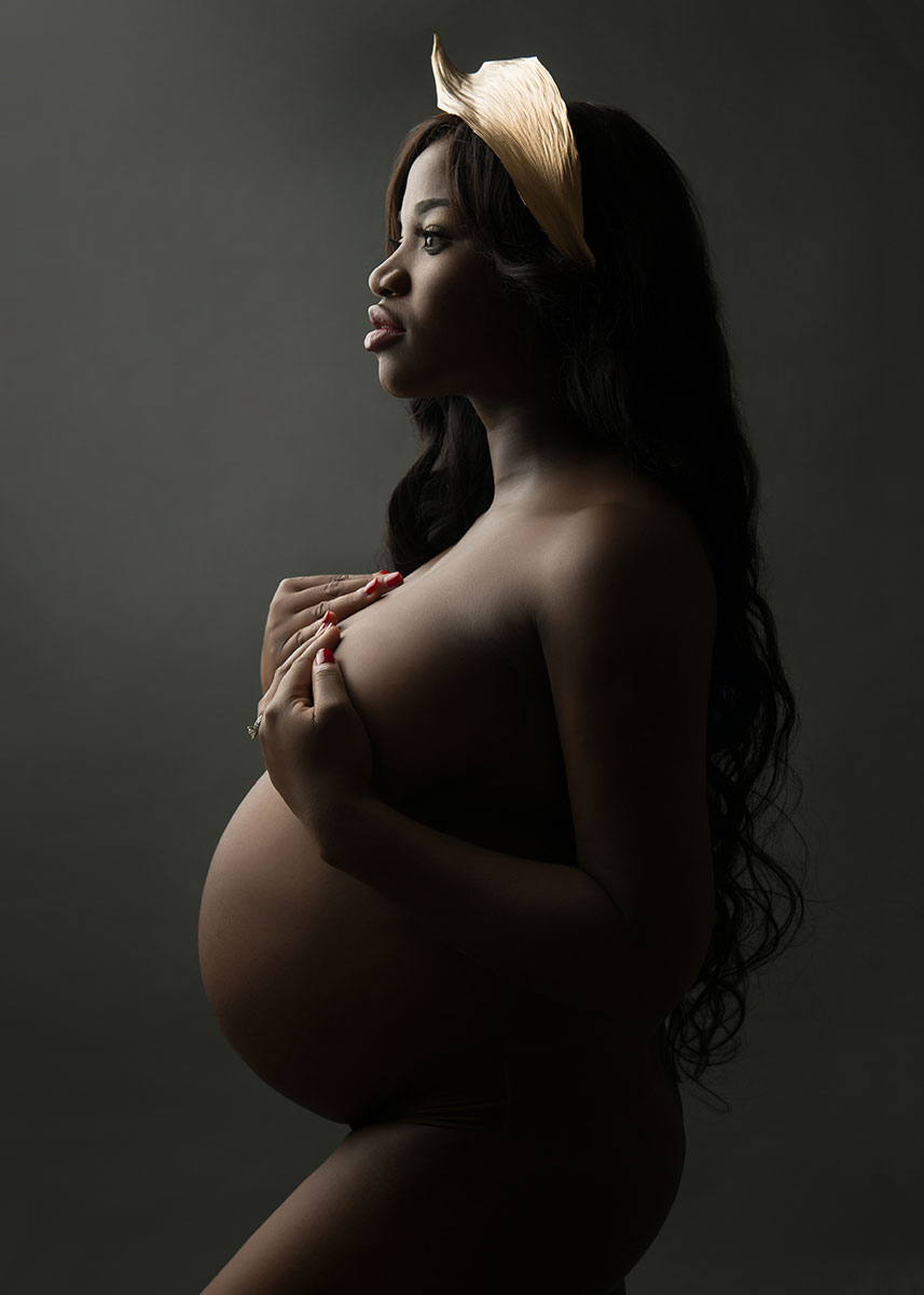 low key maternity portrait on black