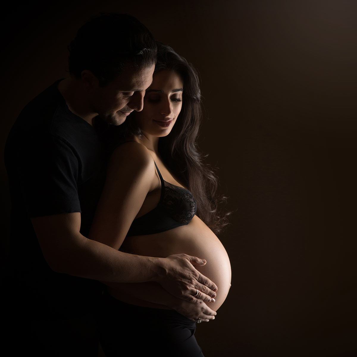 man holding maternity belly nyc photography