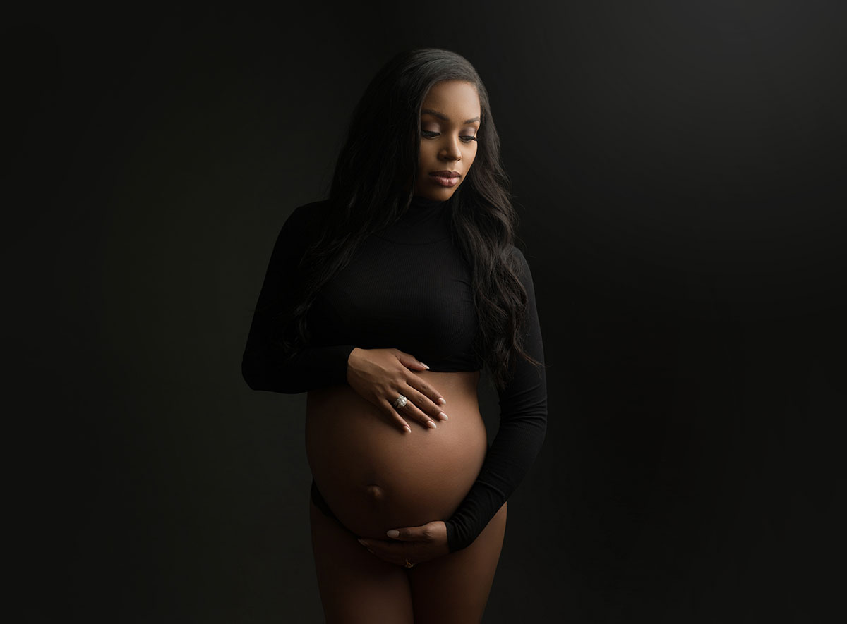 elegant maternity portrait with black crop top and lingerie