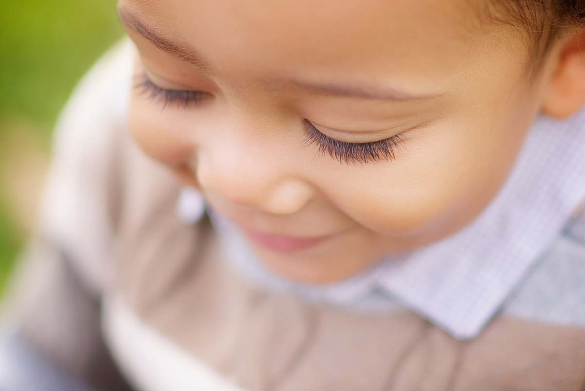 Closeup image of a young boy and his eyelashes.