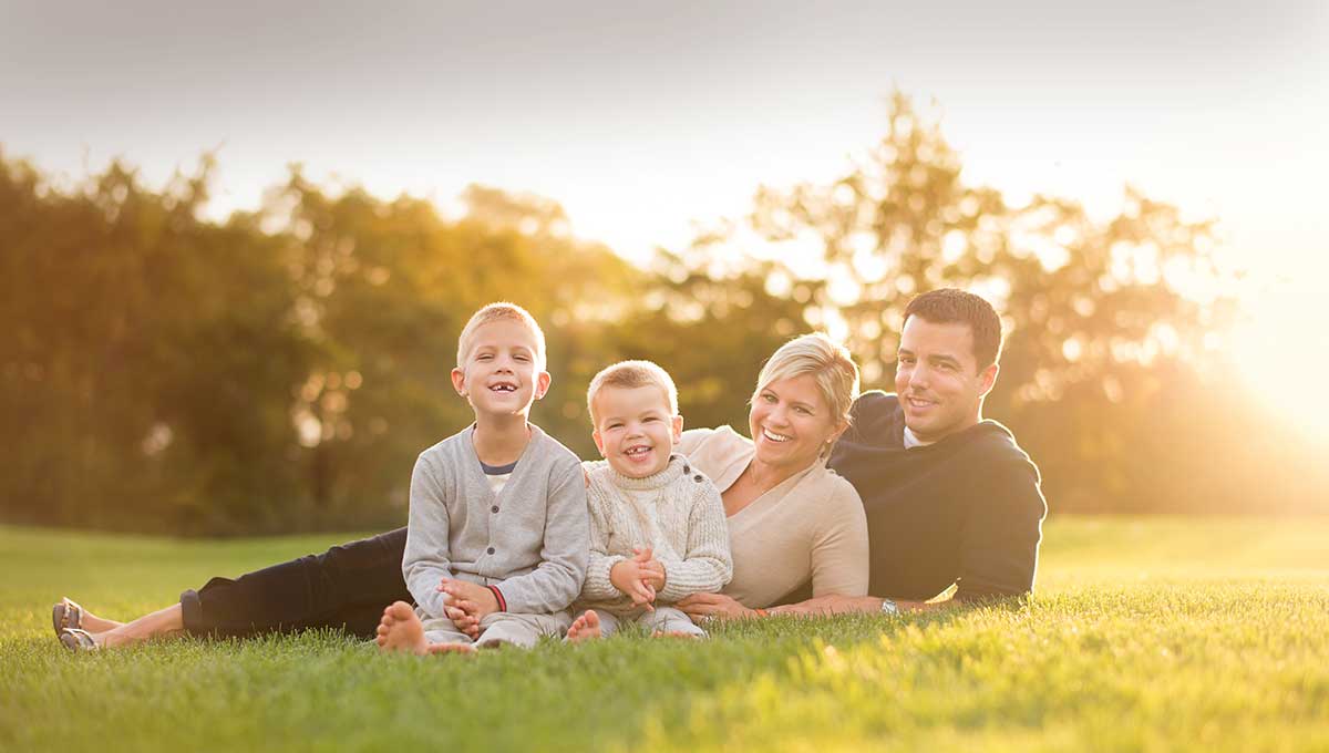 Portrait of a family in Central Park during a beautiful sunset