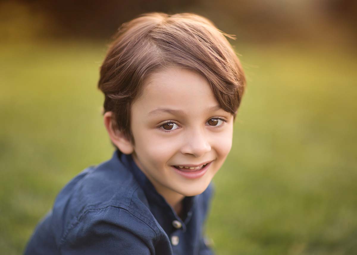 Closeup image of a boy smiling