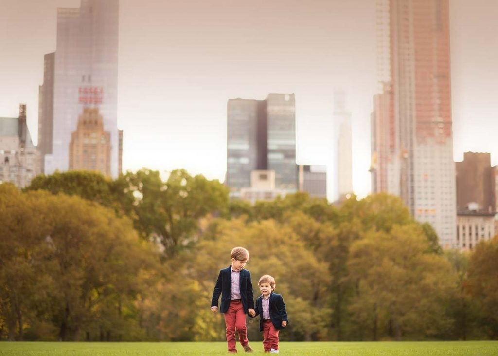 Two stylish baby brothers walking in Sheep Meadow NYC