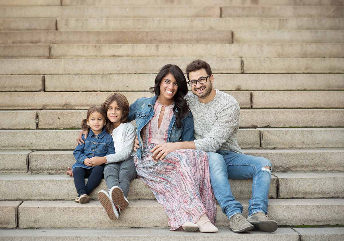 Beautiful family photo with two children taken on stairs at Bethesda Fountain NYC
