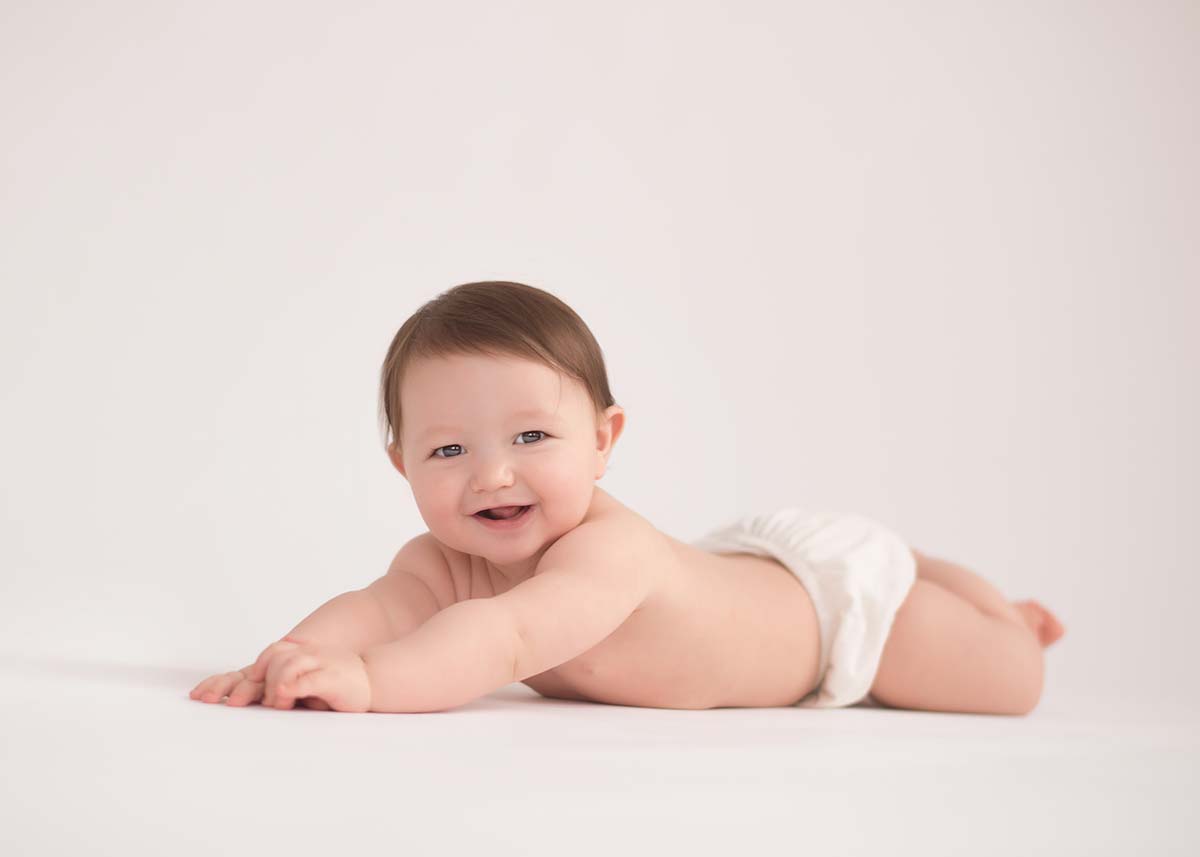 Sweet baby laying on the floor at a NYC photo studio