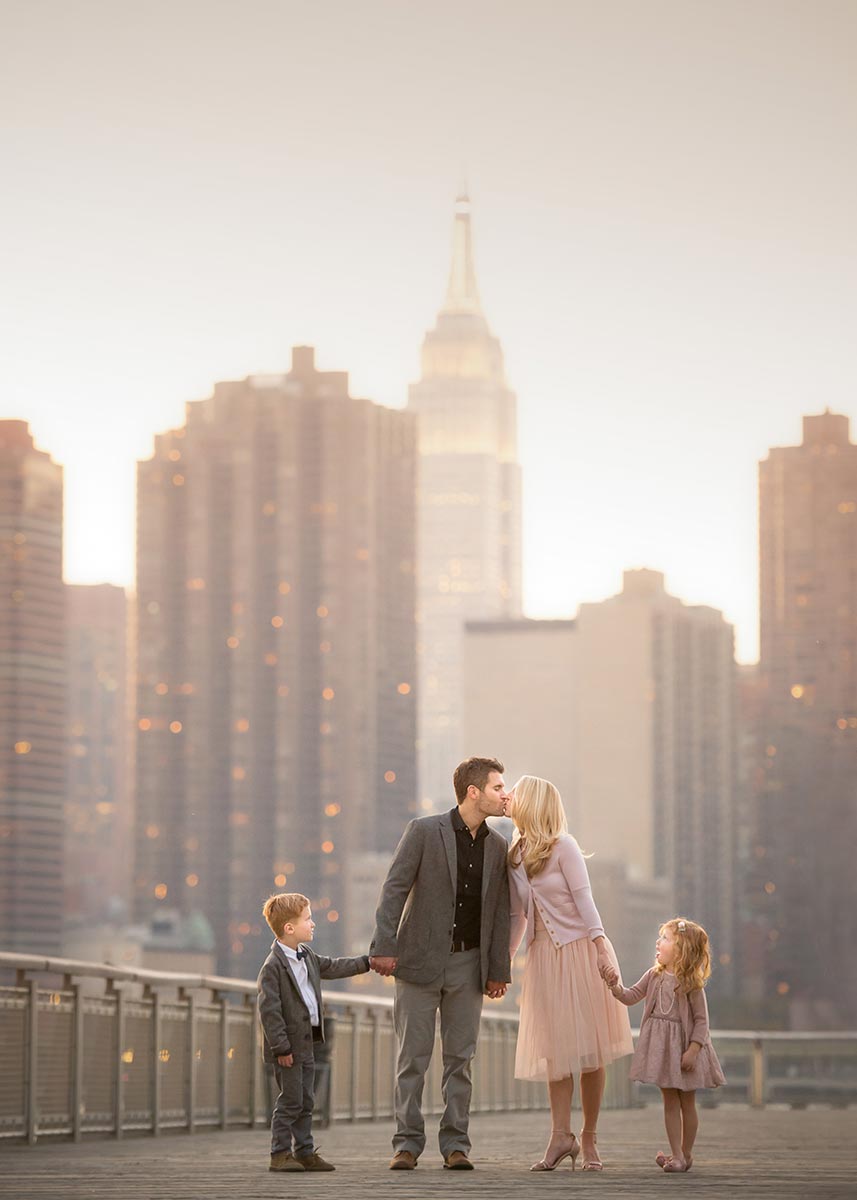 Majestic portrait of a family with Empire State Building in the background