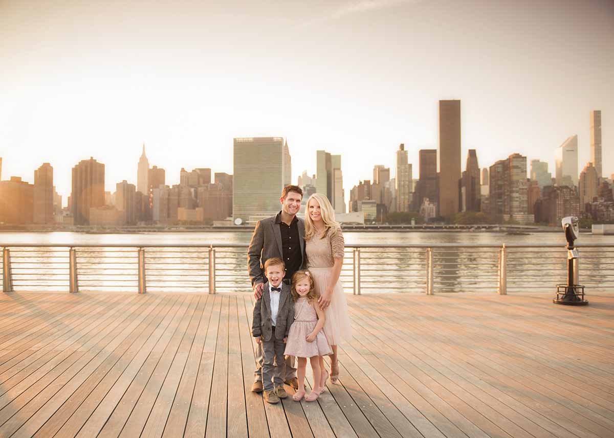 Stunning family portrait with NYC skyline and East River