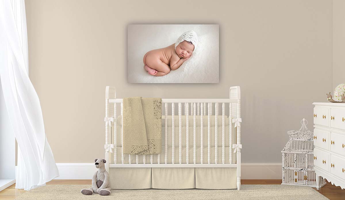 Sample of a 20x30 Gallery Wrap displayed over a baby crib
