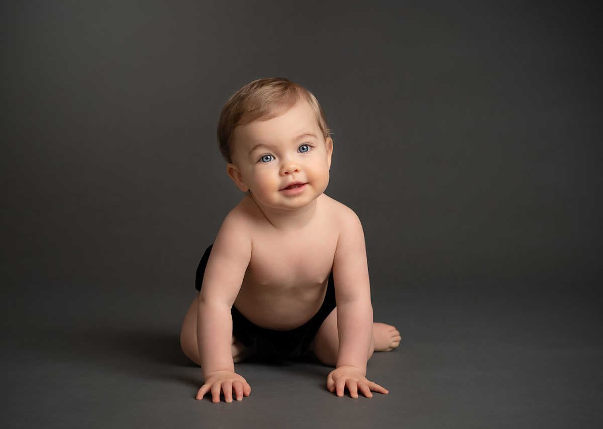 Gerber Baby crawling on a floor at a photography studio