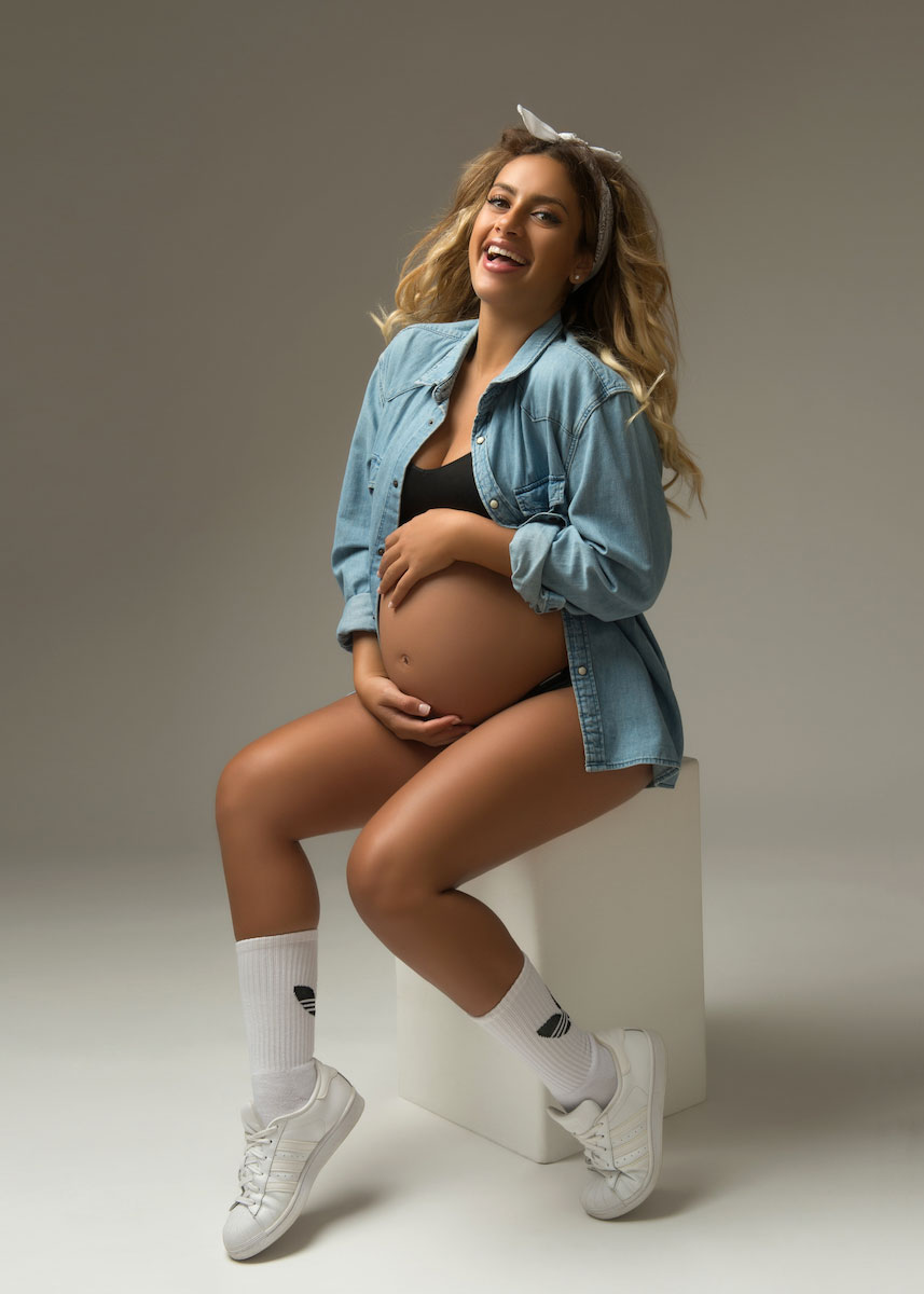 Candid maternity photo with sneakers