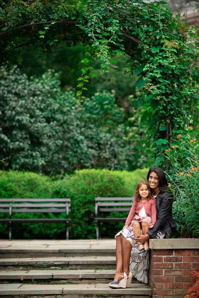 A mother and a daughter sharing a smile in NYC's Central Park