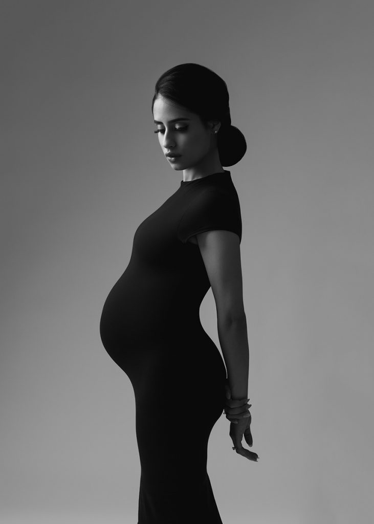 Silhouette of a pregnant woman at a NYC photo studio