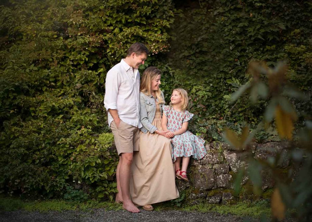 A family photo set amidst vines in Easthampton NY