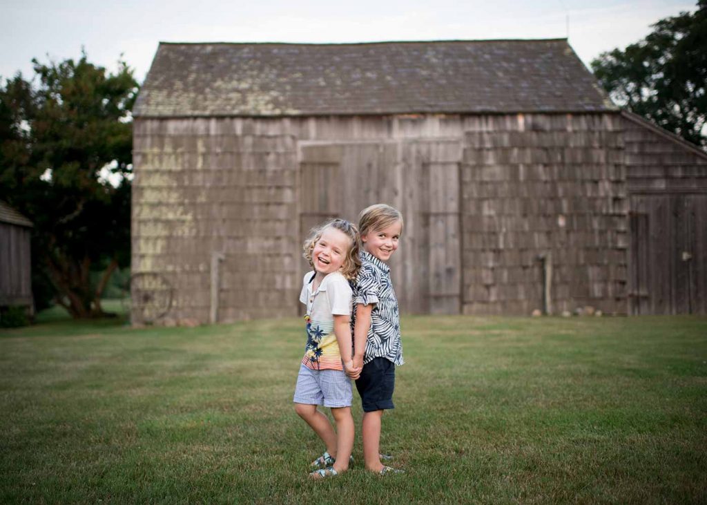 brothers-portrait-hamptons Two young boys sharing a laugh at a farm in the Hamptons