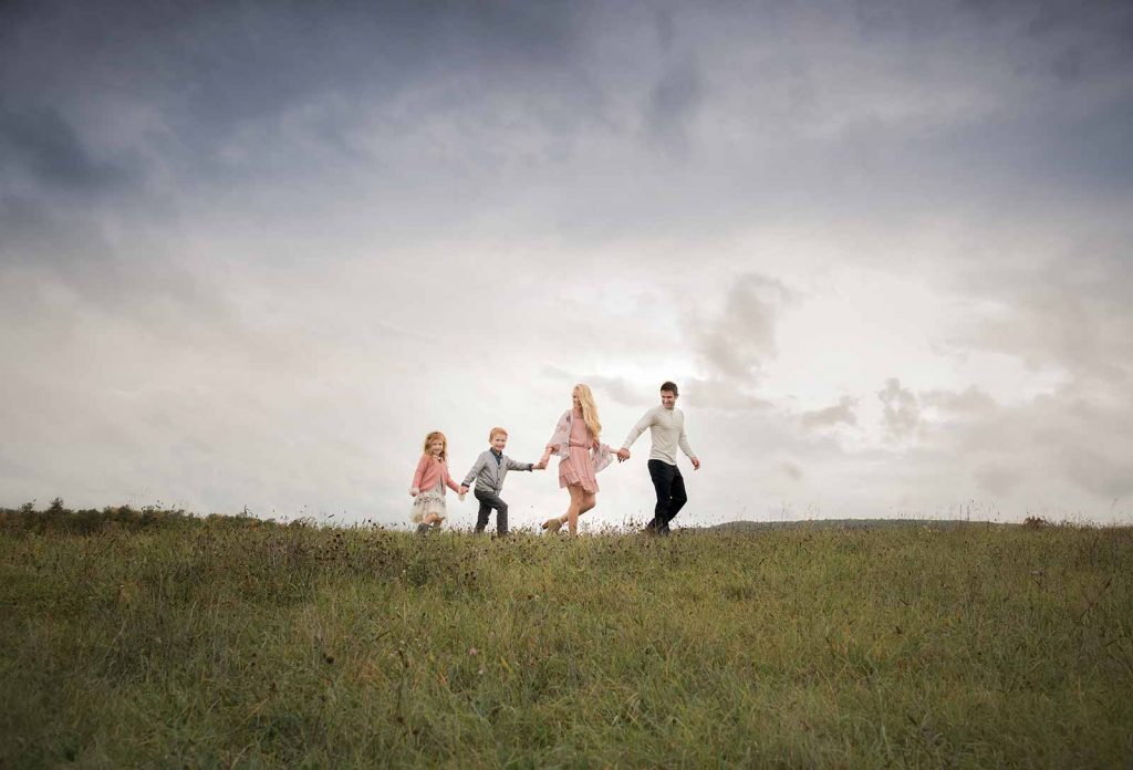 family-portrait-holding-hands Family holding hands and walking along a ridge near Sag Harbor, NY
