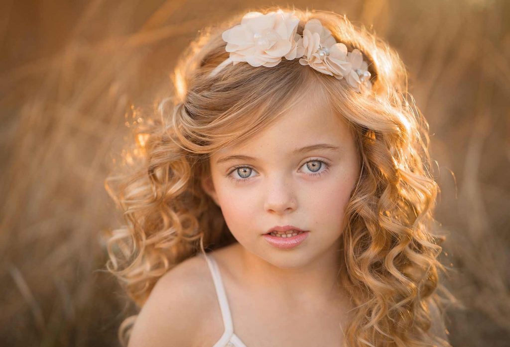sag-harbor-girl-beautiful Girl with curly hair standing in a field in Sag Harbor, NY