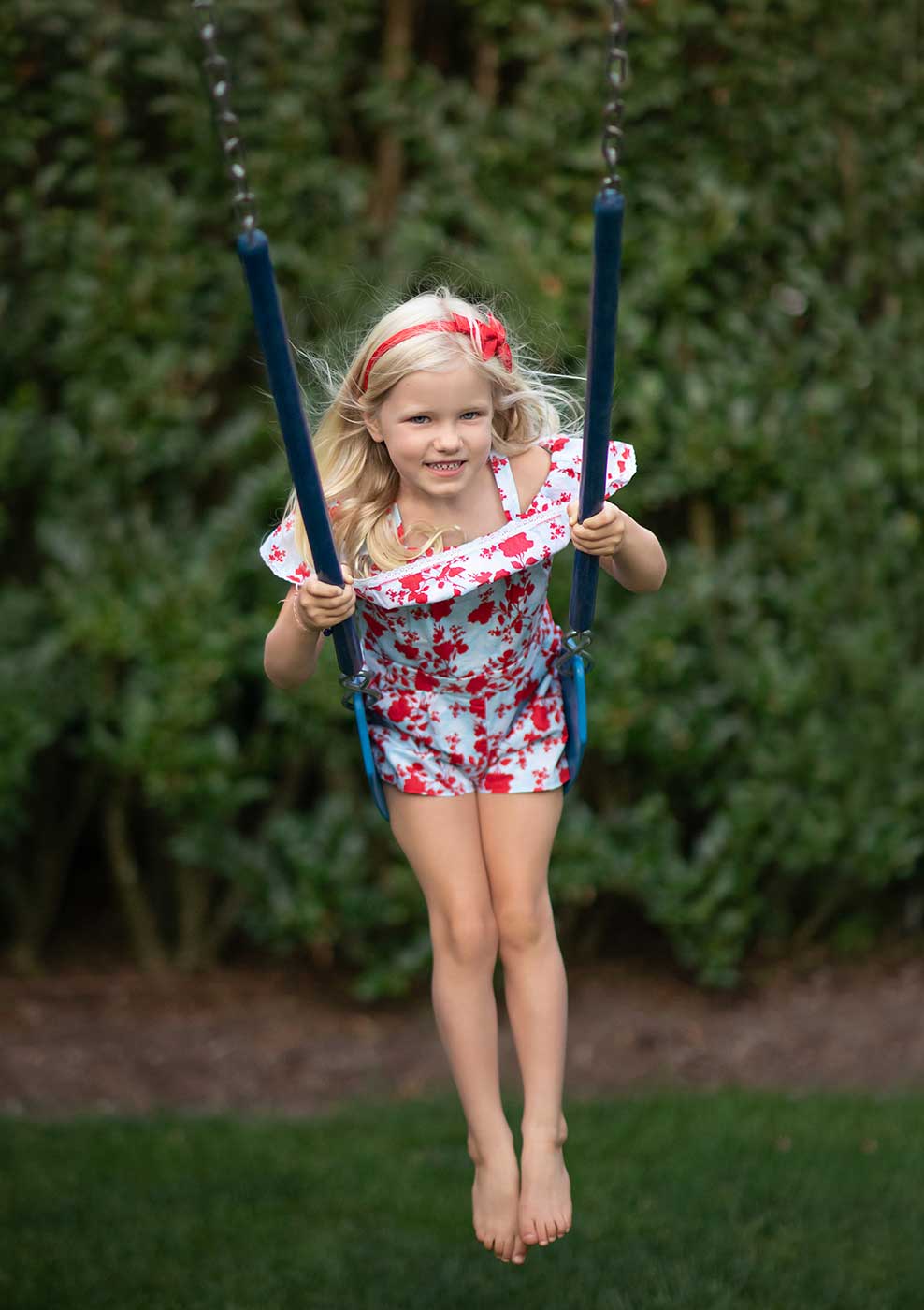 Young girl on a swing in Bridgehampton NY