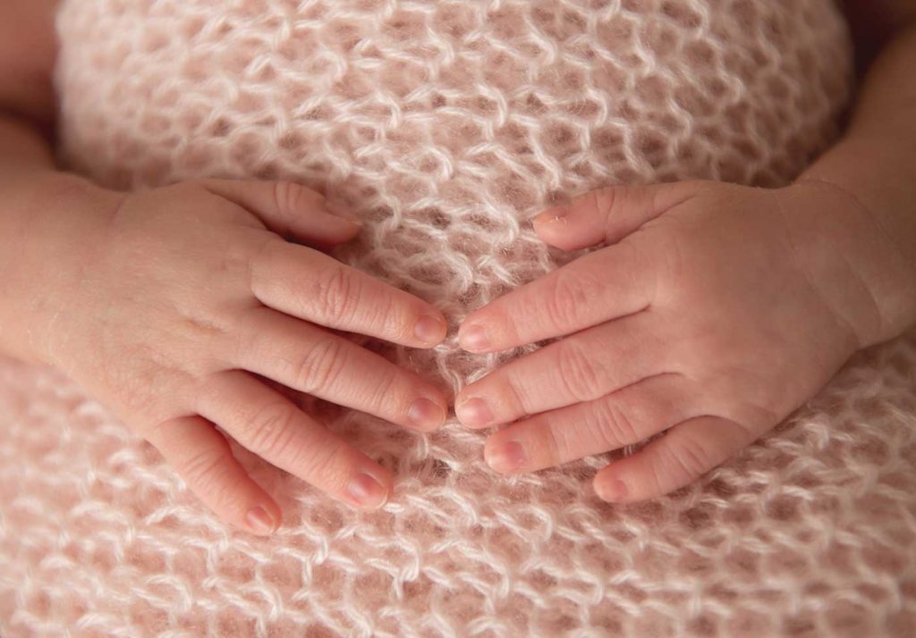 Closeup image of newborn baby's hands