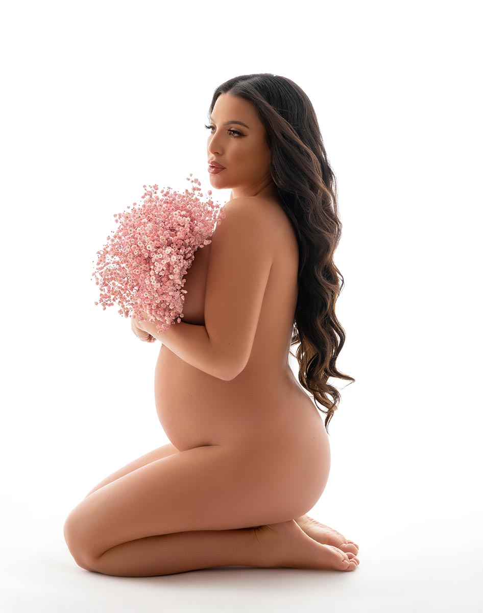 Maternity photo shoot in NYC with flowers and a topless model