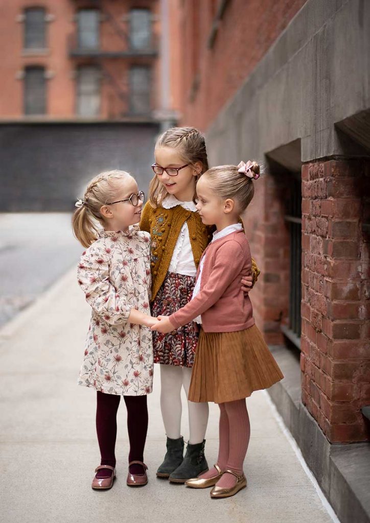 Three sisters having fun in the streets of Tribeca NYC