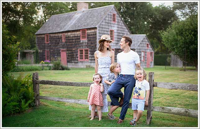 A modern family portrait of a NYC family sharing a happy moment at a farm in Easthampton, NY.