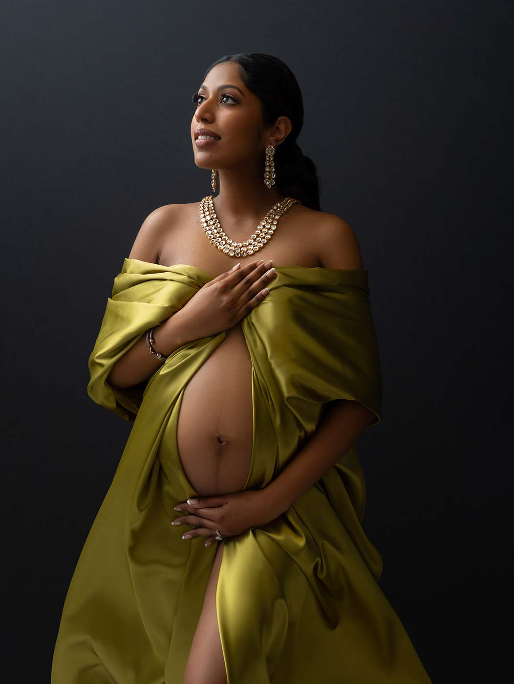 Beautiful lime silk fabric worn by a pregnant woman in NYC