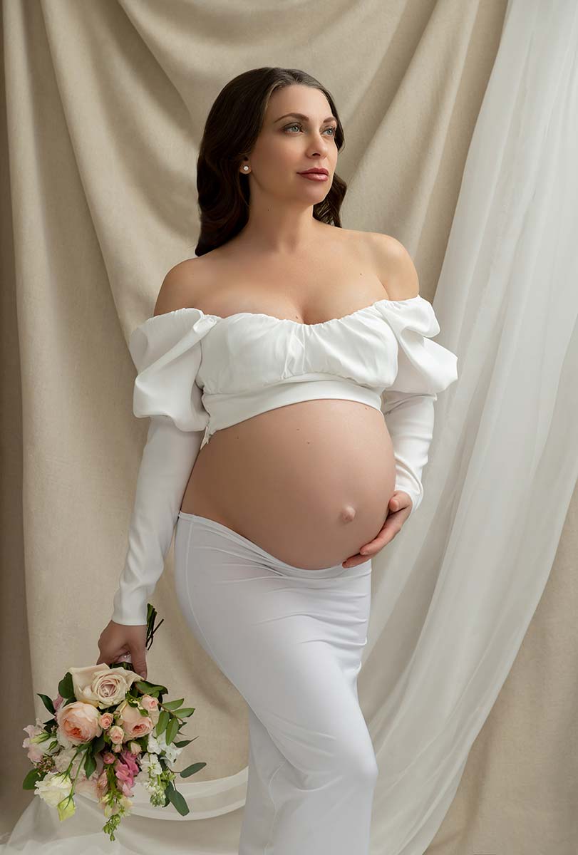 Pregnant woman holding flowers