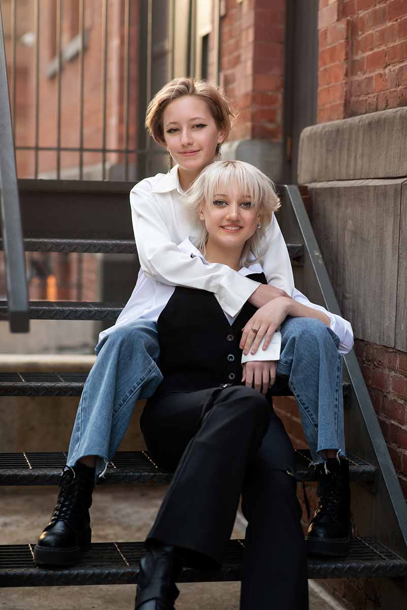 Portrait of two teenage sisters taken on the cobblestone streets of Tribeca in New York City