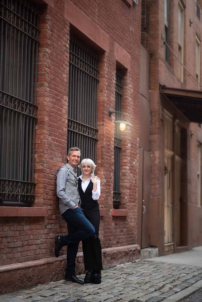 Photo of a father and his teen daughter taken on cobblestone streets of Tribeca NYC