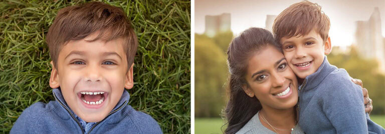 On the left, a young boy with brown hair and a blue jacket lies on the grass, smiling joyfully. On the right, the same boy is held by his mother with long dark hair, both smiling at the camera with Central Park's greenery and cityscape in the background.