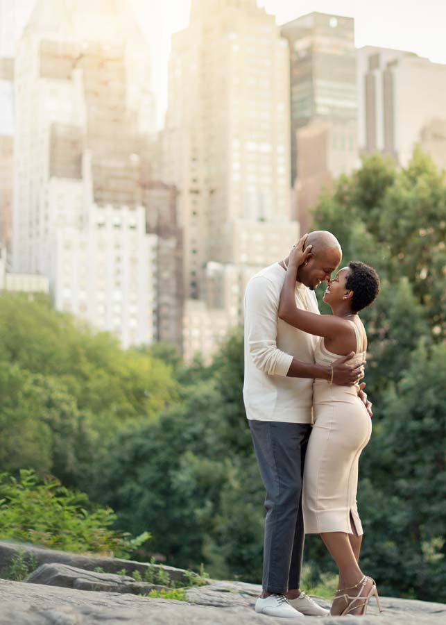 A stylish NYC couple shares a laugh in Central Park