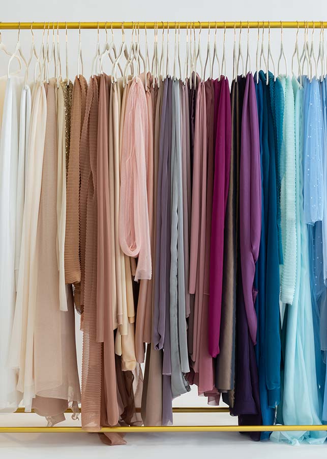 A group of colorful fabric on a swinger, styled with the artistic touch of Michael Kormos Photography studio.